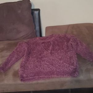 Fluffy sweater the color is burgundy